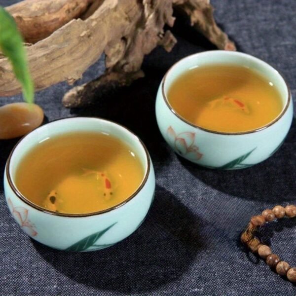 1700708063956-2220919bd0804723bbe489990c984811-goods.jpeg 80ml/2.82oz Traditional Celadon Hand-painted Landscape Teacup Ceramic for Lotus Carp Tea Set Double-fish Chinese Tea Master Cup